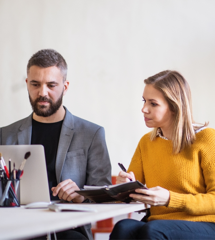 two-business-people-with-wheelchair-in-the-office-PMJT9V555